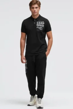 Kurzarmpolo aus Pikee mit Artworks black | M