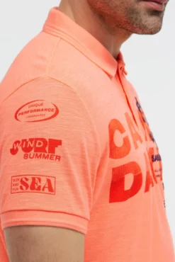 Pikee-Polo mit Artworks und Puffprint-Details neon flame